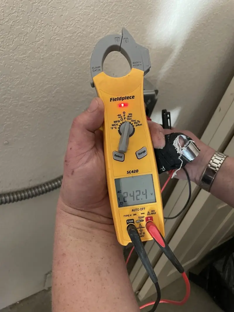 Voltage testing with clamp meter during Generator Installation in Magnolia